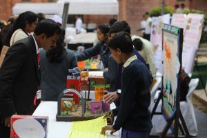 Students explaining their model to visitors